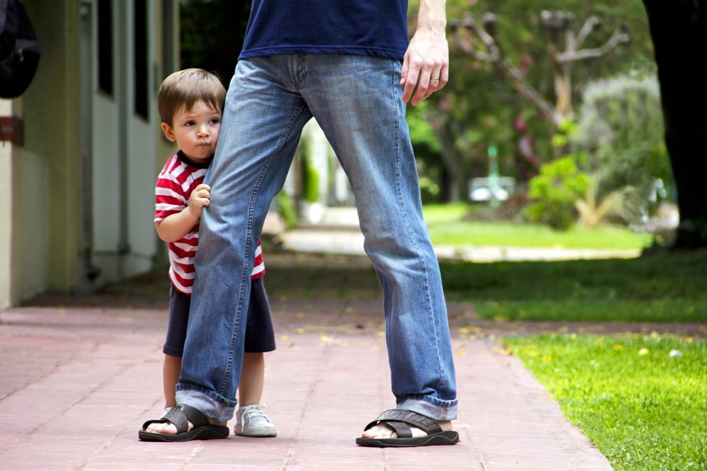 boy hiding behind dad.jpeg
